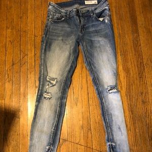 Skinny mid rise denim jeans with holes